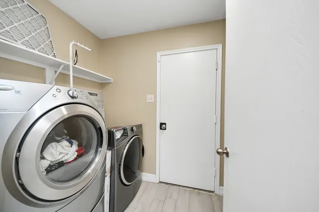 a utility room with dryer and washer