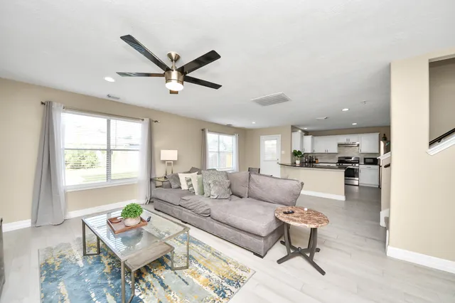 a living room with furniture and a window