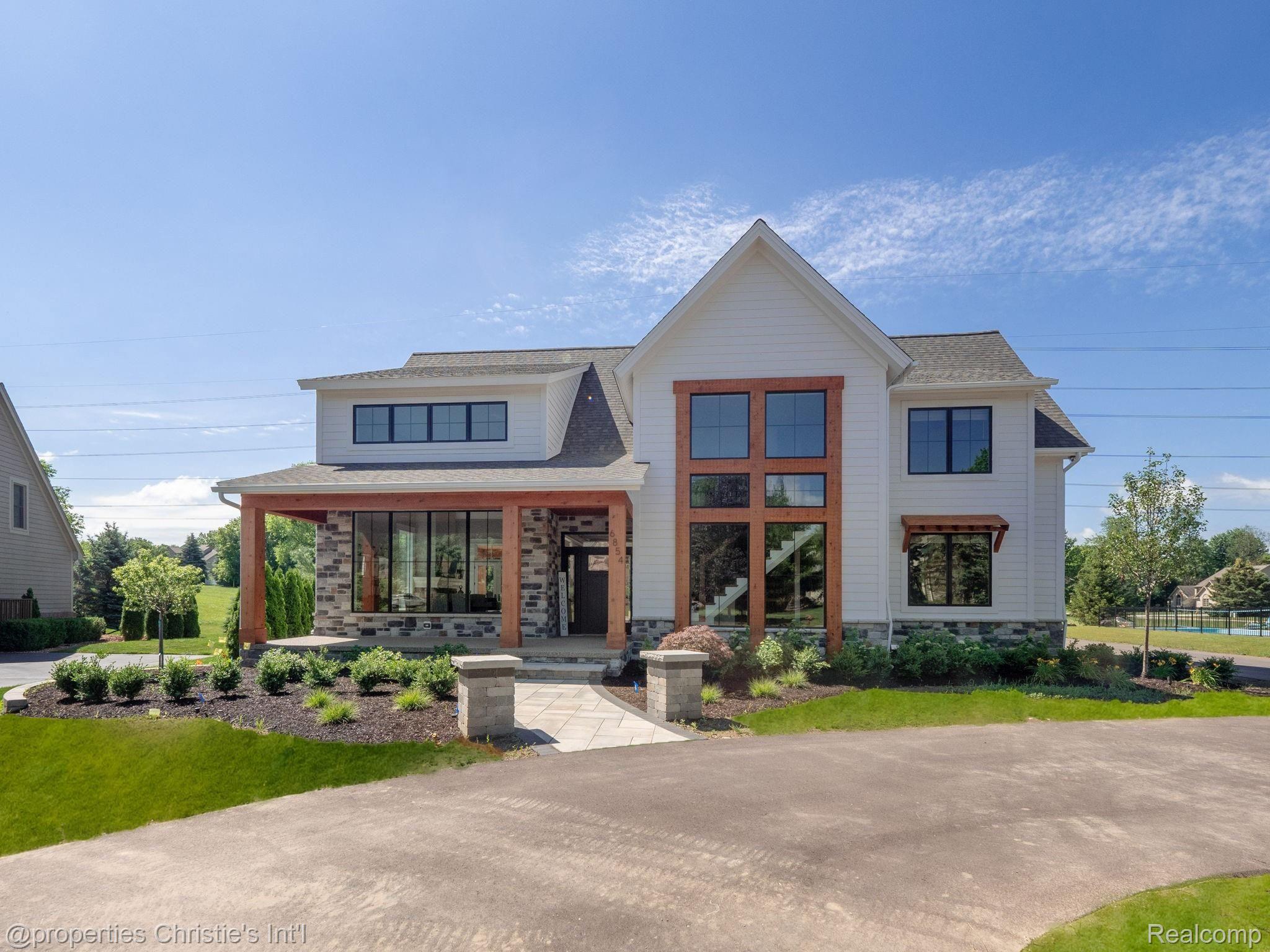 6854 Woodcrest Ridge Clarkston, MI 48346 - Photo 1 of 56 Welcome to 6854 Woodcrest! *DIGITALLY ENHANCED TO ADD GRASS*