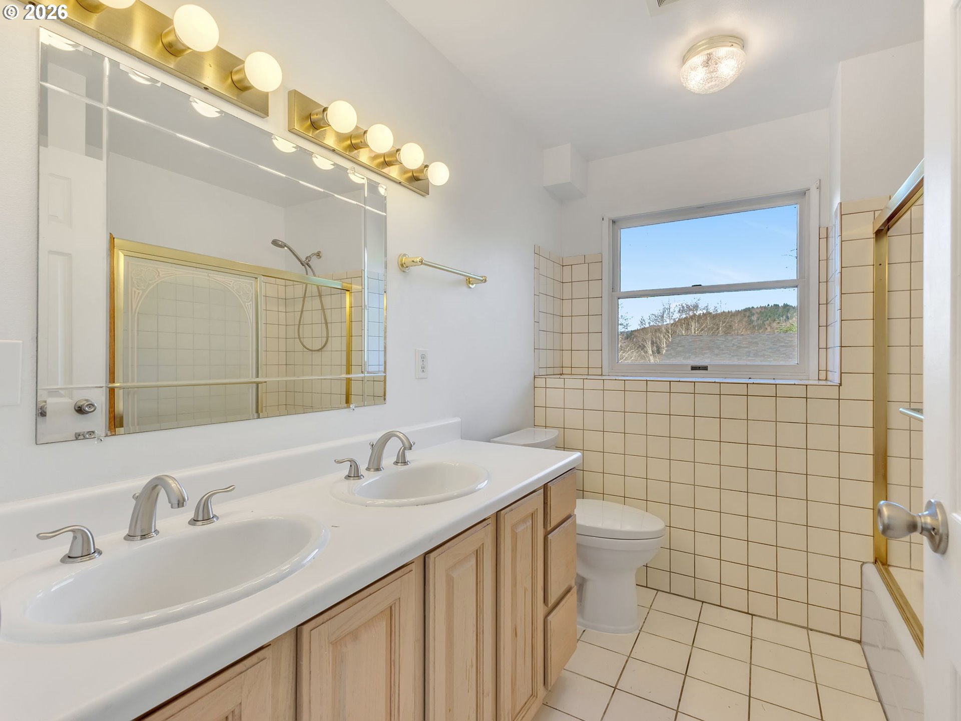32300 Miami Foley Road Nehalem, OR 97131 - Photo 13 of 45 a bathroom with a sink a toilet and mirror