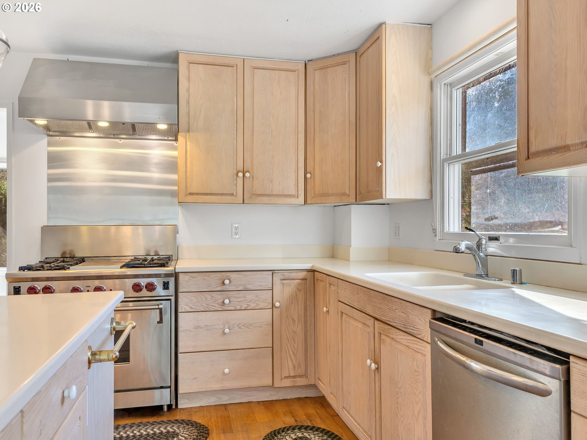 32300 Miami Foley Road Nehalem, OR 97131 - Photo 20 of 45 a kitchen with a sink stove and cabinets