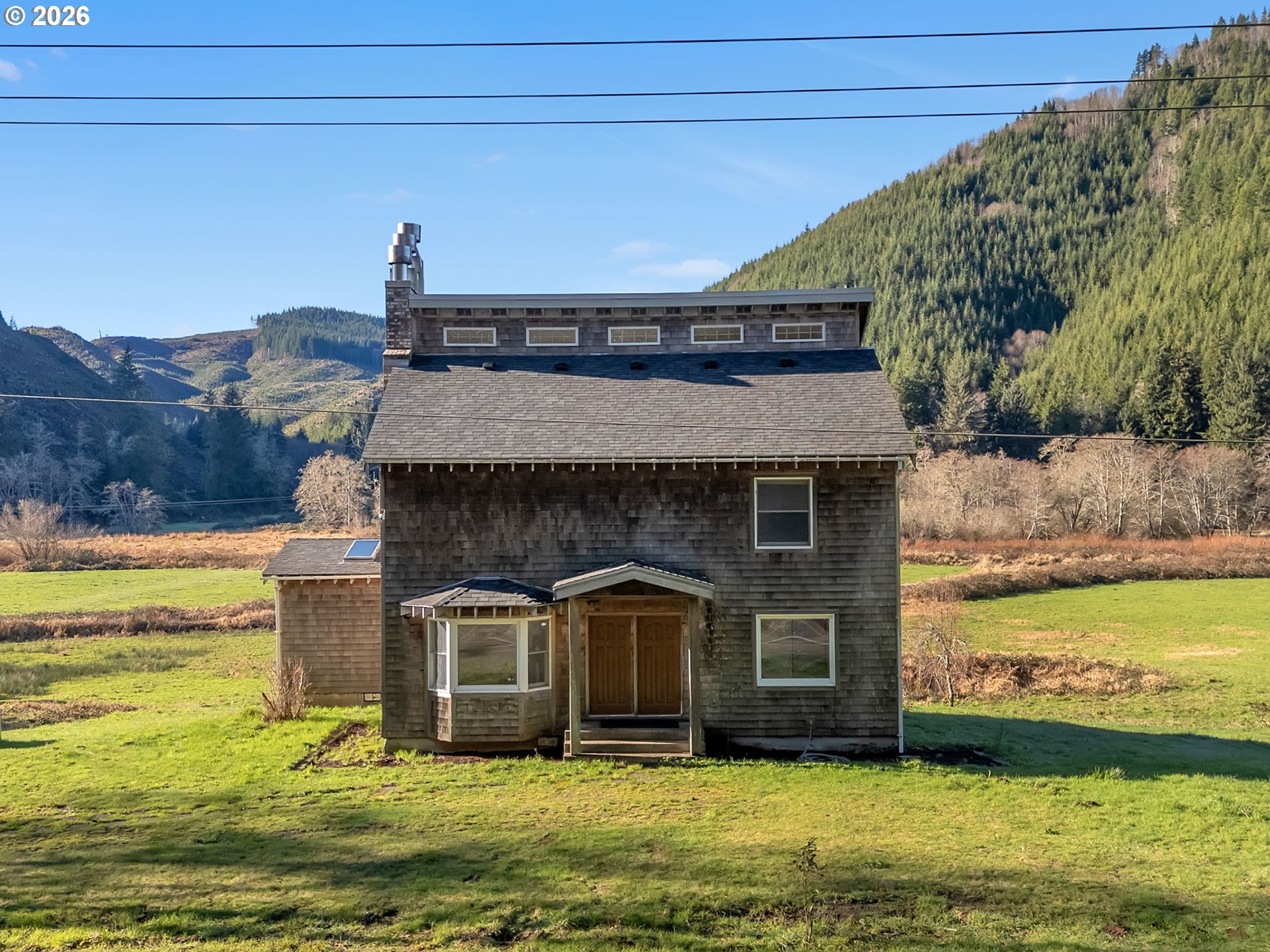 32300 Miami Foley Road Nehalem, OR 97131 - Photo 29 of 45 a front view of a house with a yard
