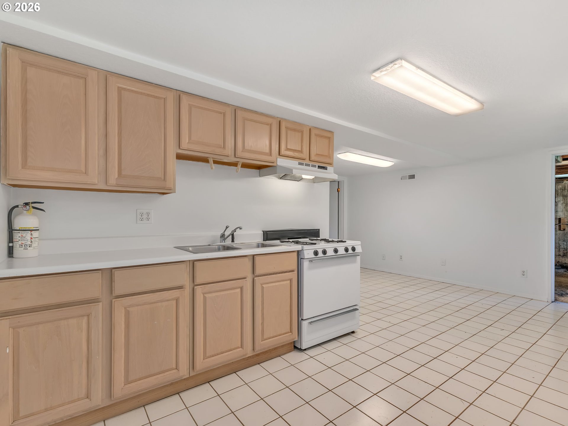 32300 Miami Foley Road Nehalem, OR 97131 - Photo 33 of 45 a kitchen with granite countertop white cabinets and stainless steel appliances