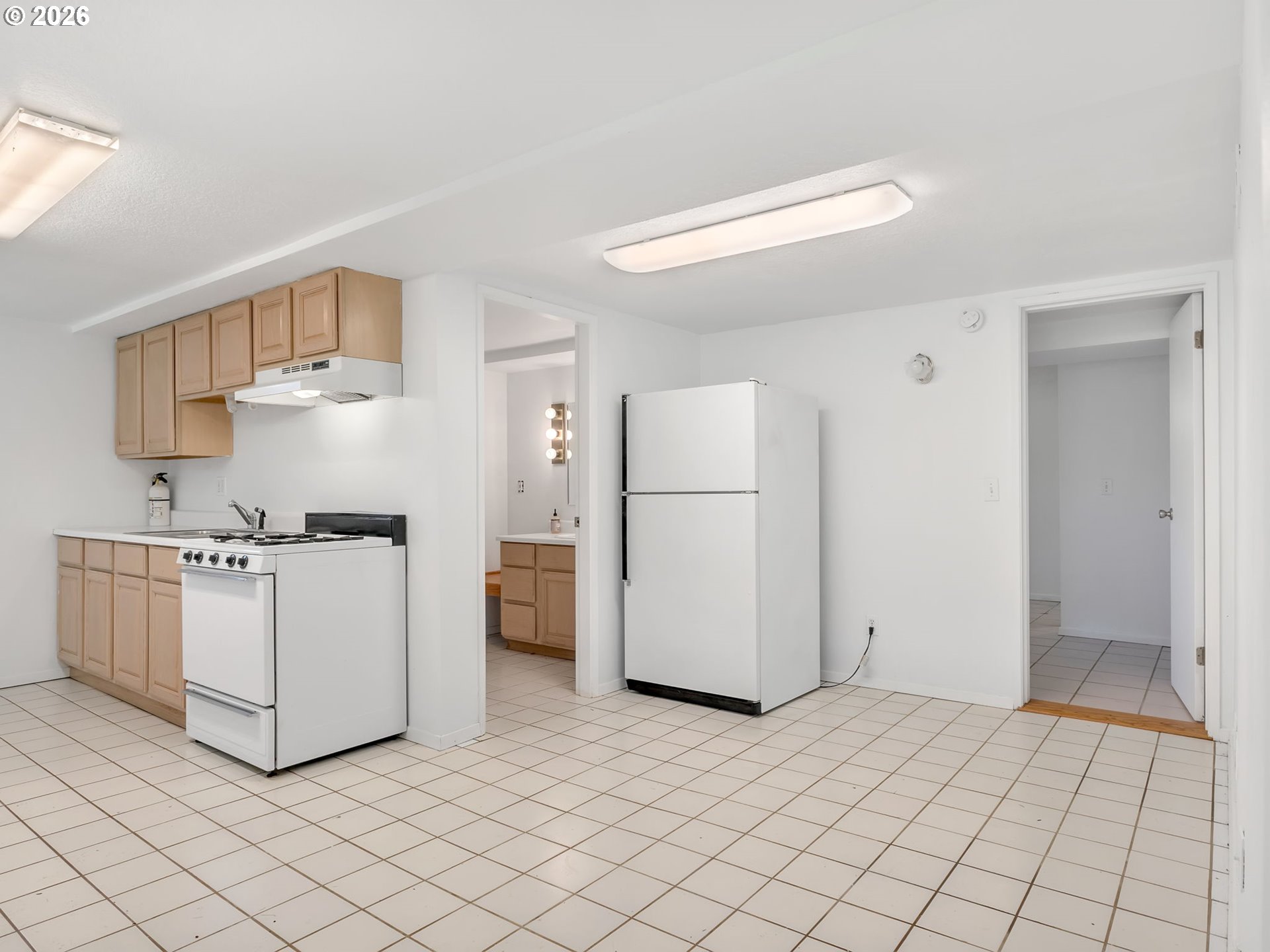 32300 Miami Foley Road Nehalem, OR 97131 - Photo 34 of 45 a kitchen with a refrigerator a stove top oven and a cabinets