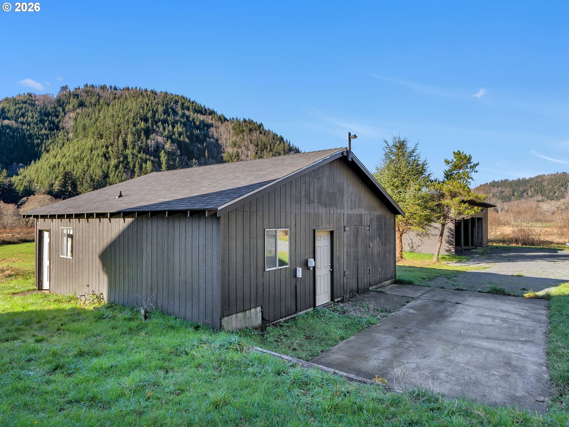 32300 Miami Foley Road Nehalem, OR 97131 - Photo 39 of 45 a view of a house with a yard plants and large tree