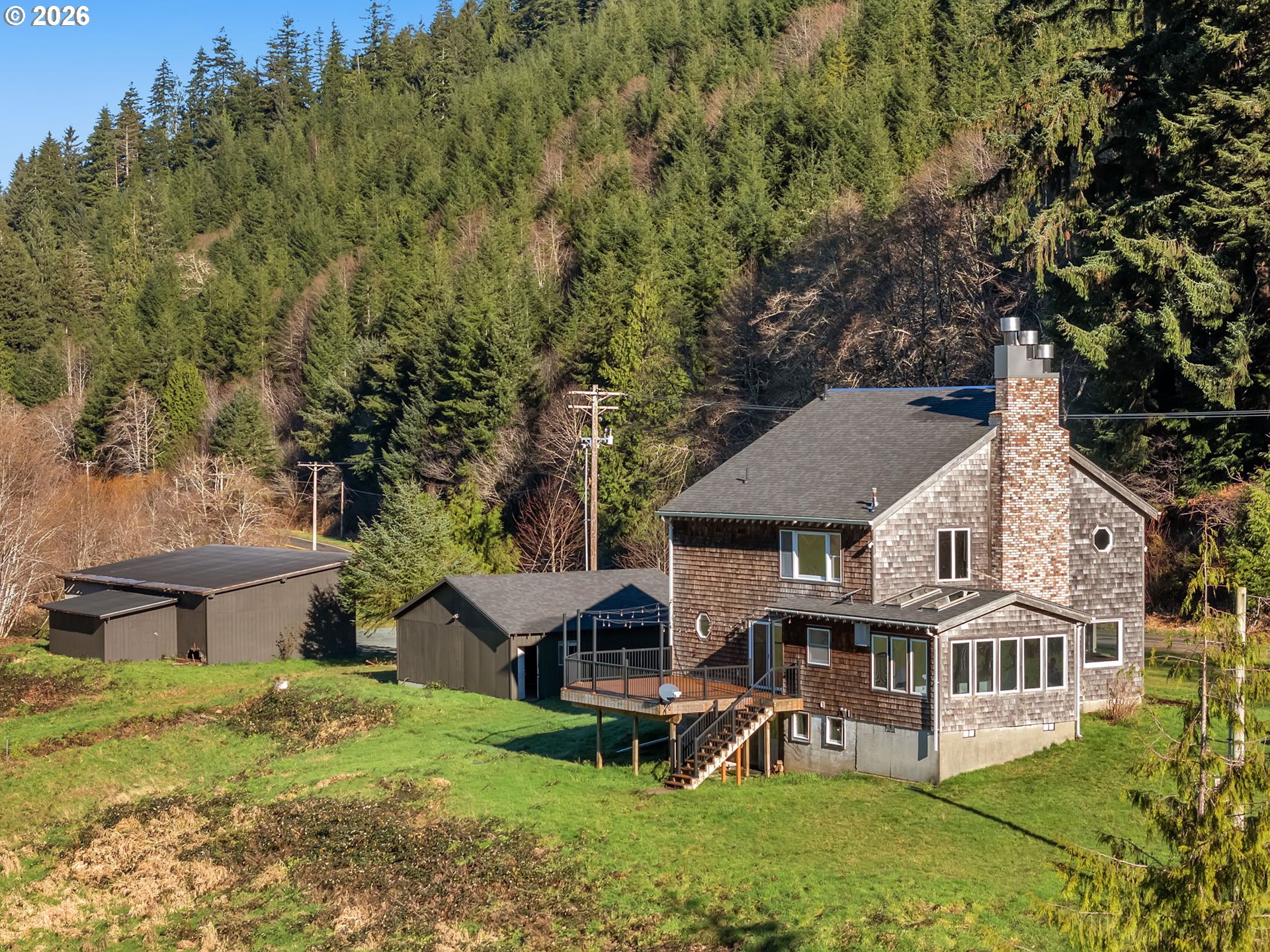 32300 Miami Foley Road Nehalem, OR 97131 - Photo 44 of 45 an aerial view of a house with a yard table and chairs