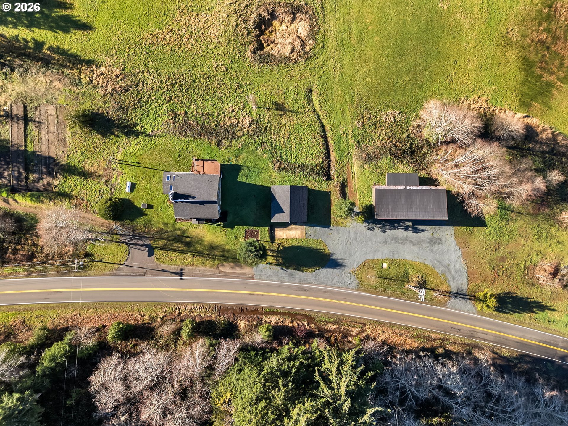 32300 Miami Foley Road Nehalem, OR 97131 - Photo 6 of 45 a front view of a house with a yard and lake view