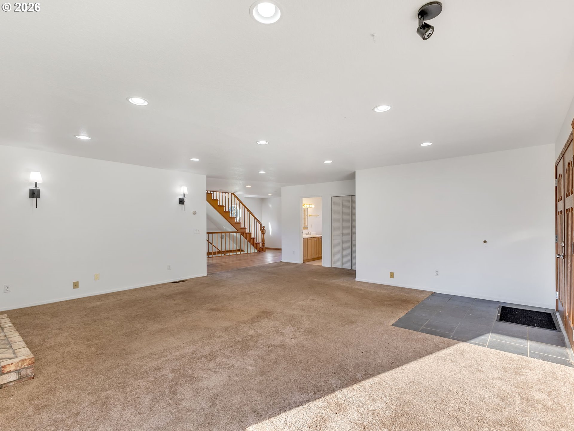32300 Miami Foley Road Nehalem, OR 97131 - Photo 9 of 45 an empty room with a space and a ceiling fan