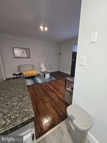 a bathroom with a toilet and a mirror