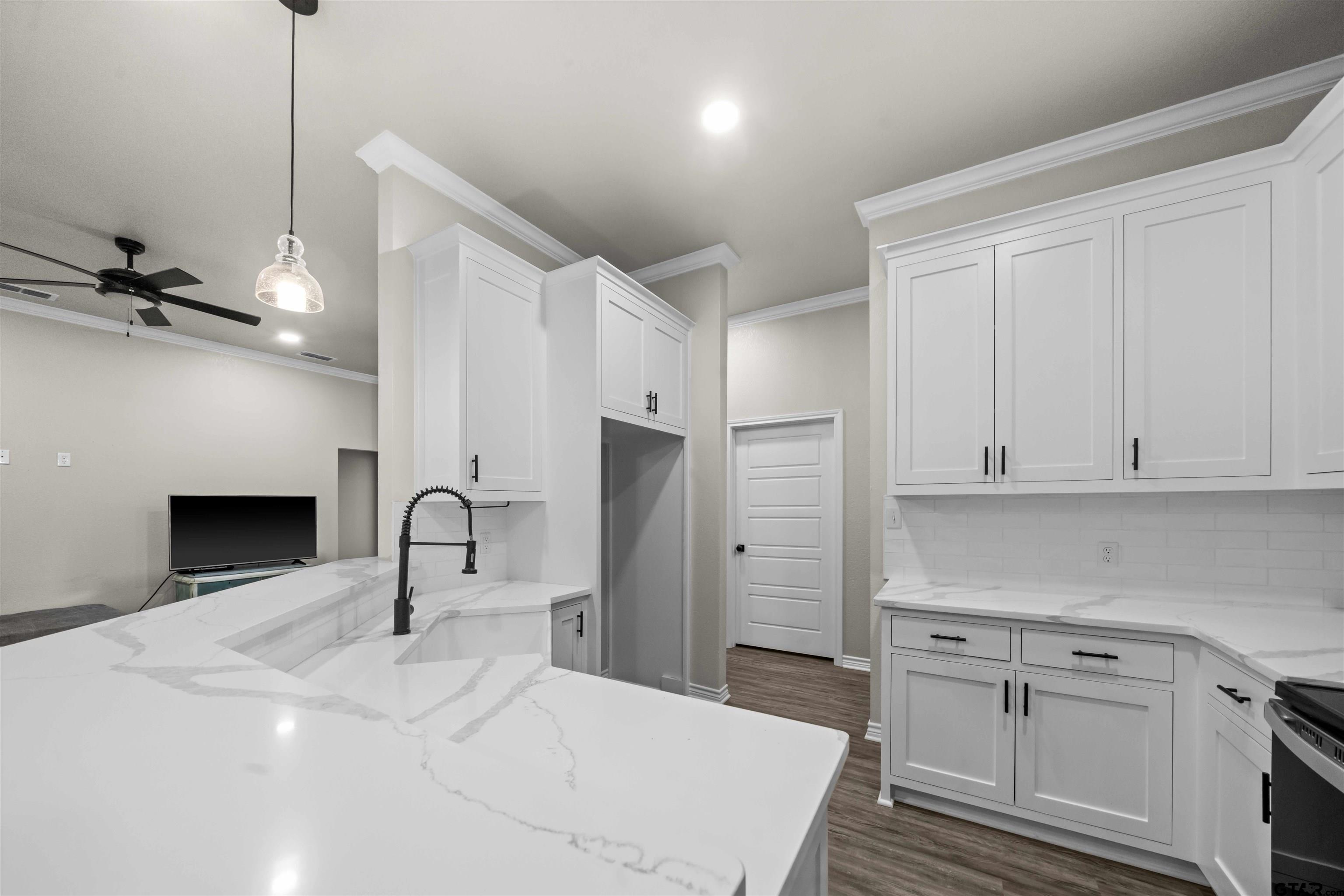 17023 County Road 2282 Troup, TX 75789 - Photo 11 of 30 a kitchen with stainless steel appliances a refrigerator sink and cabinets