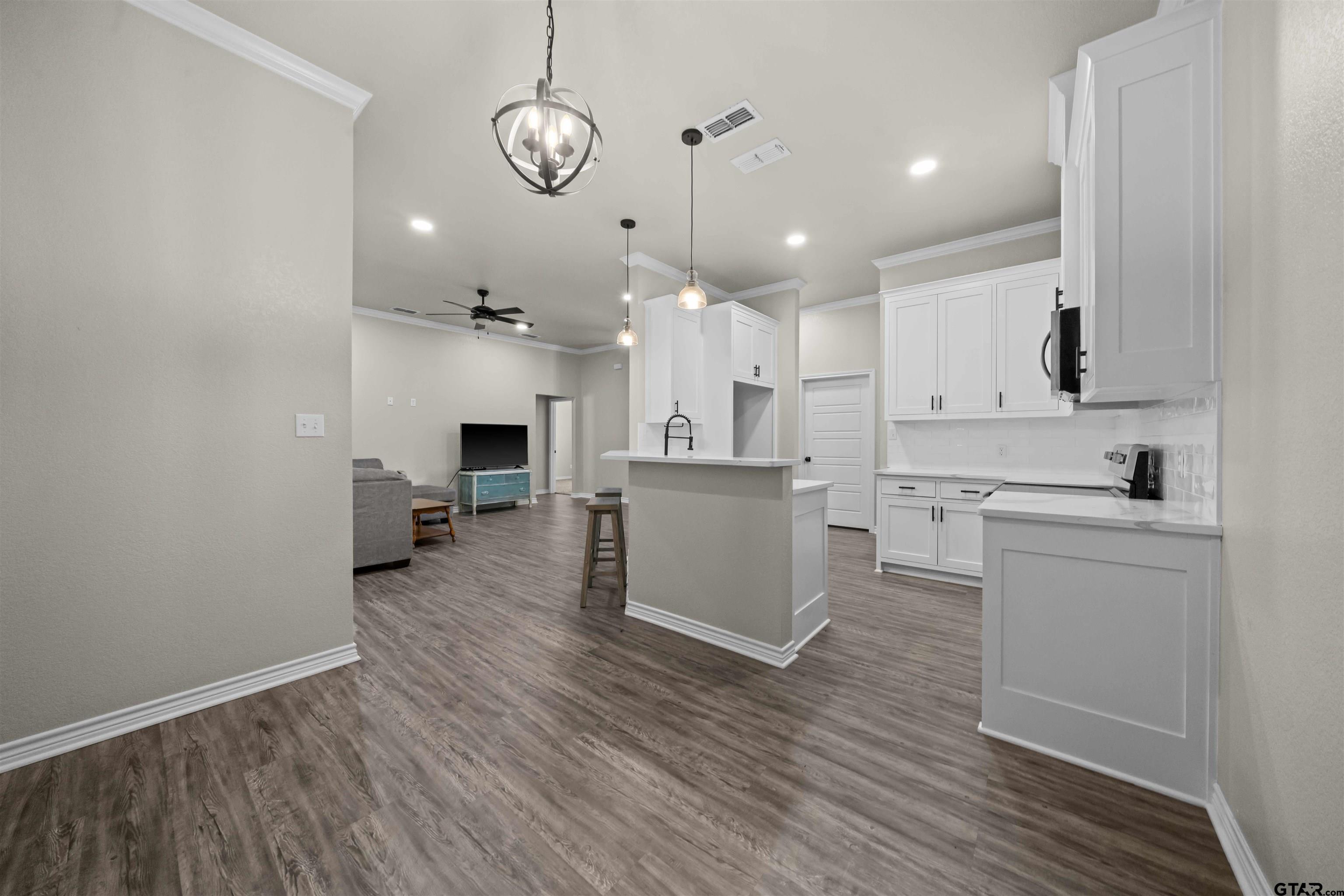 17023 County Road 2282 Troup, TX 75789 - Photo 12 of 30 a open kitchen with white cabinets and stainless steel appliances