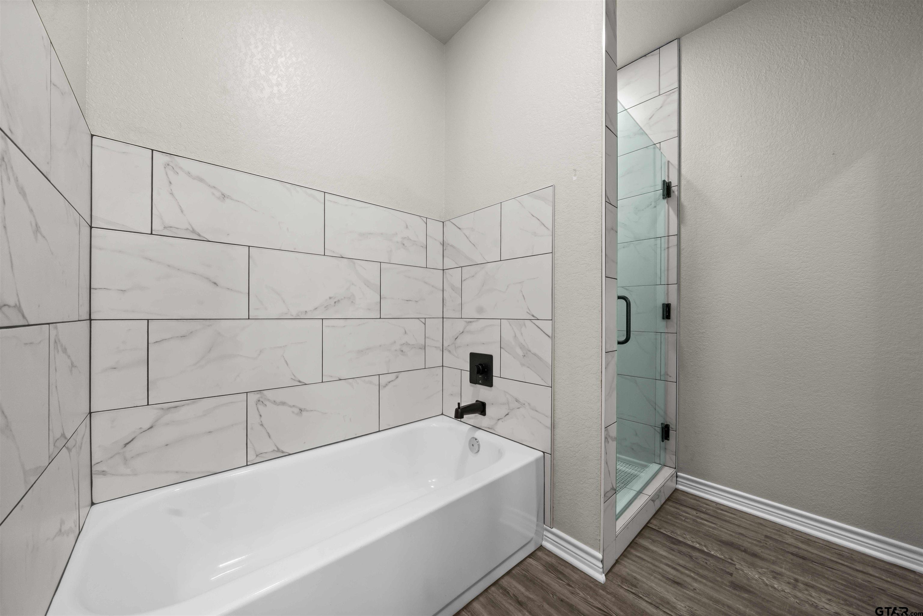 17023 County Road 2282 Troup, TX 75789 - Photo 17 of 30 a bathroom with a bathtub