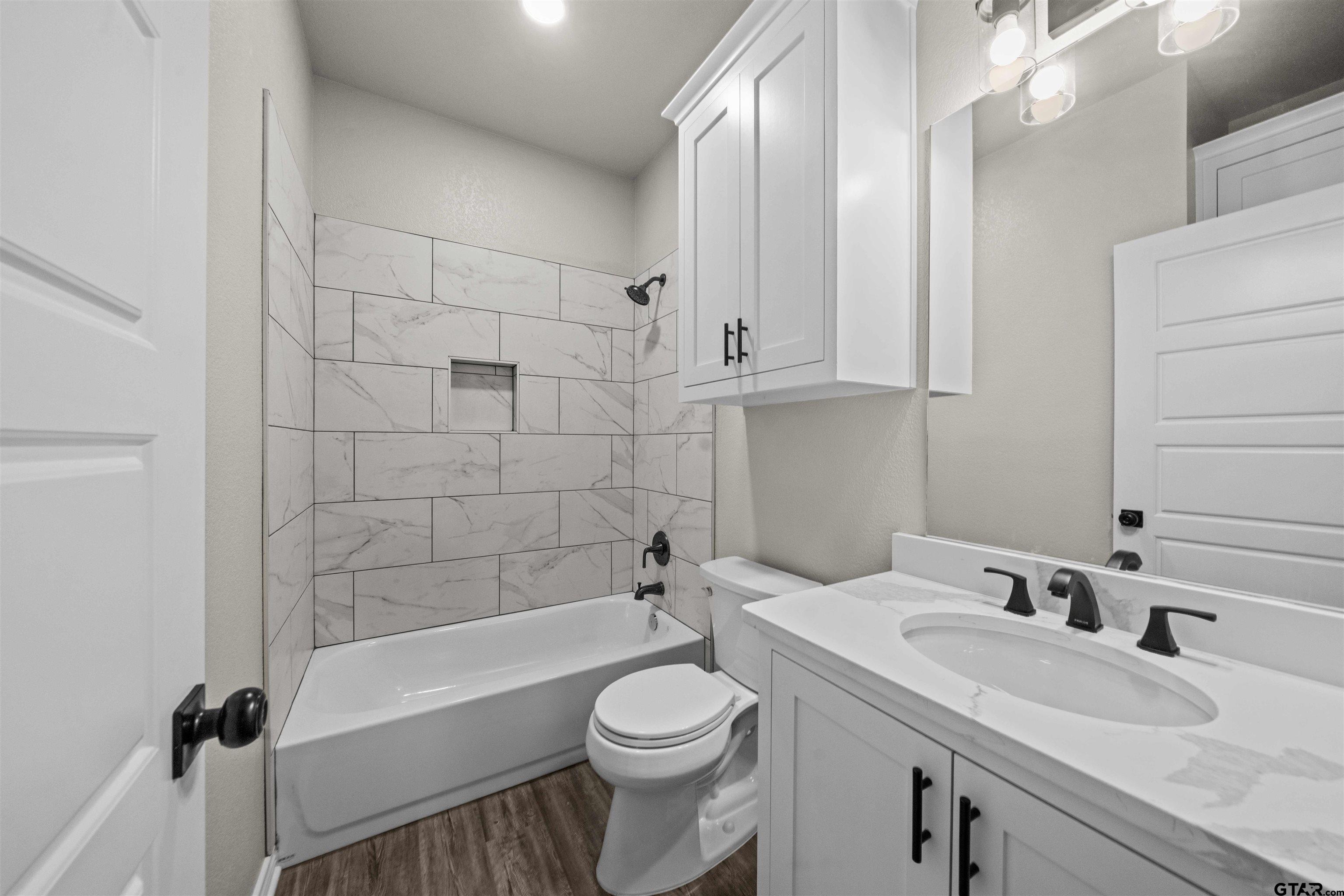 17023 County Road 2282 Troup, TX 75789 - Photo 24 of 30 a bathroom with a sink a toilet and shower