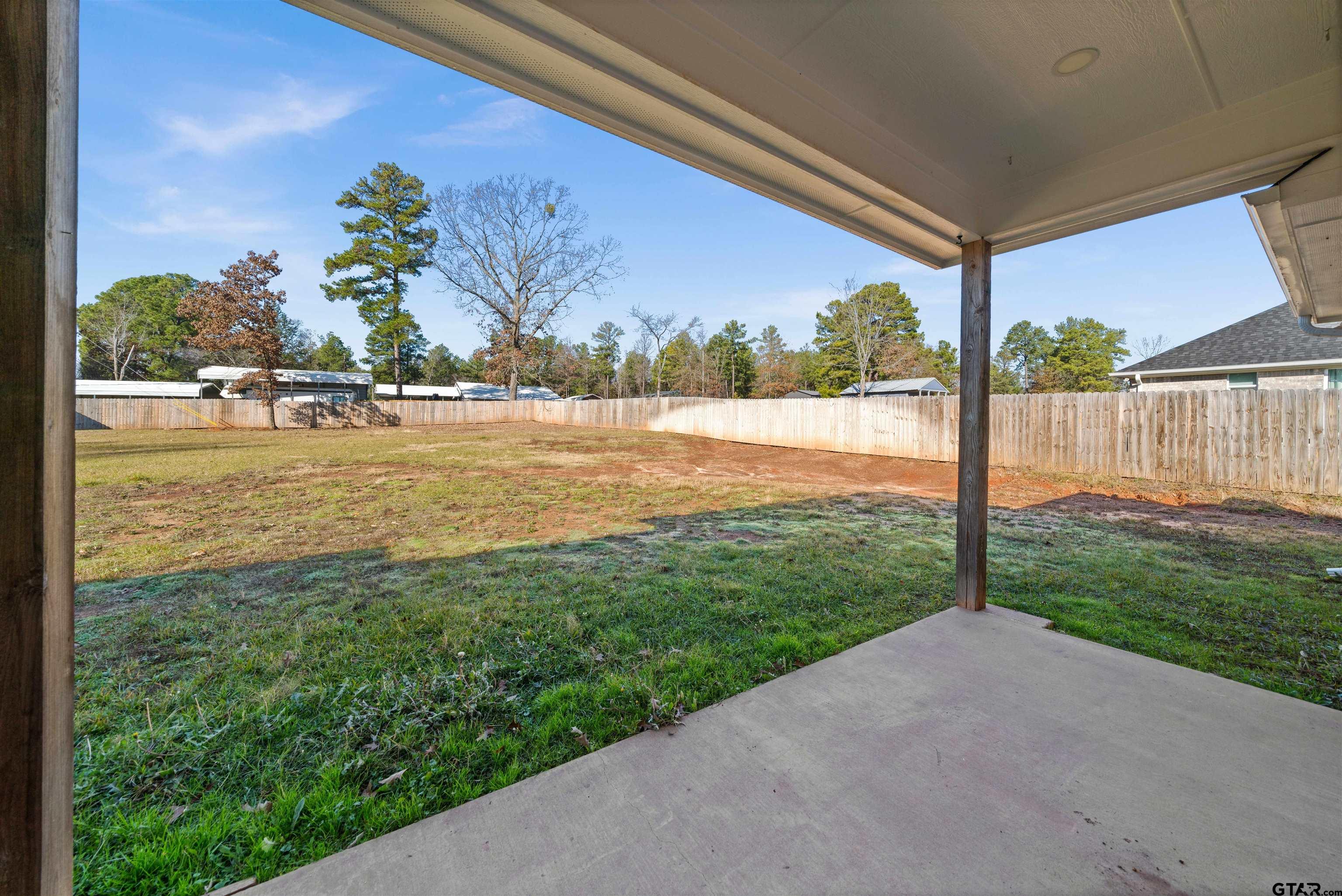 17023 County Road 2282 Troup, TX 75789 - Photo 26 of 30 a view of a lake with a big yard
