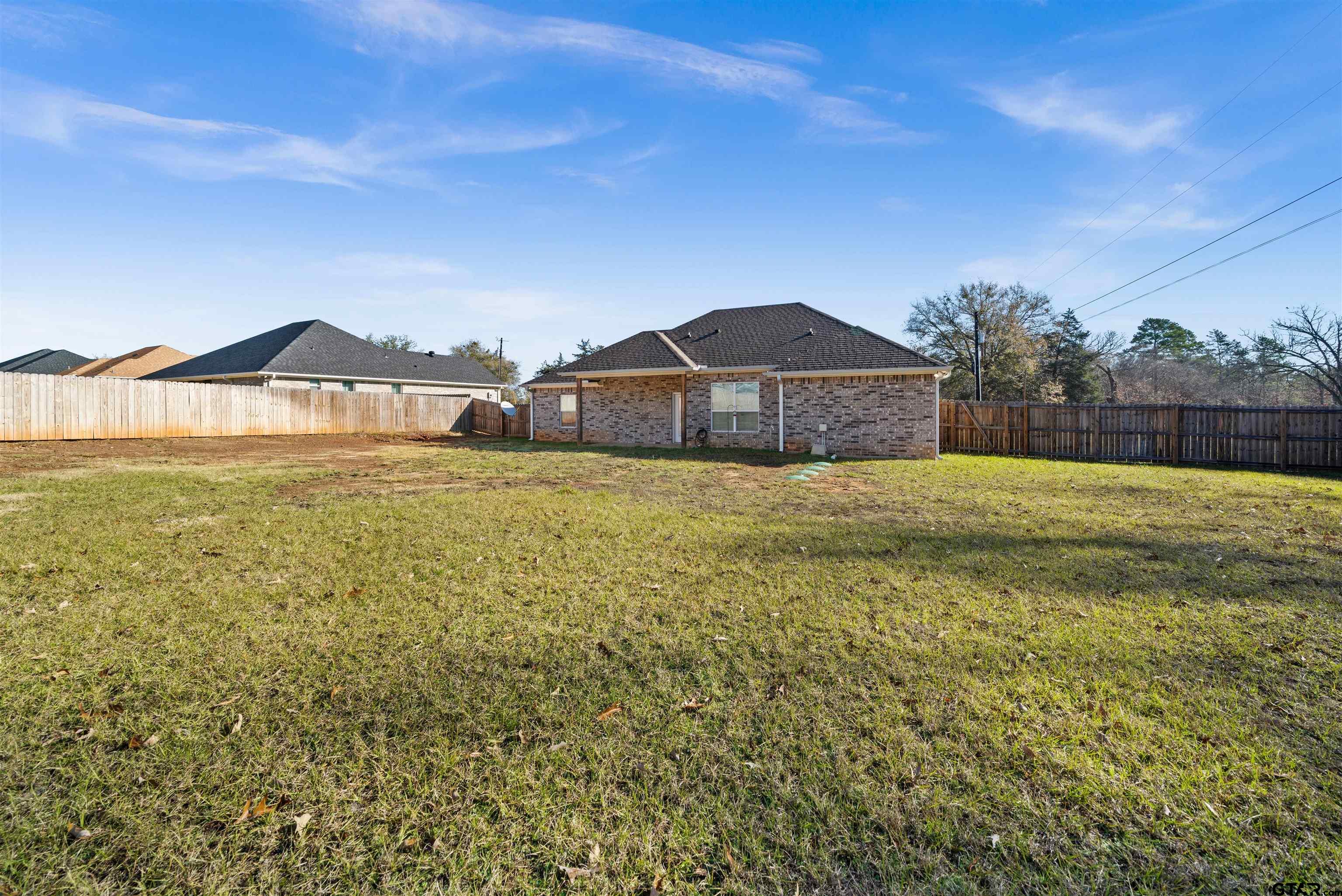 17023 County Road 2282 Troup, TX 75789 - Photo 28 of 30 a large house with a big yard and large trees