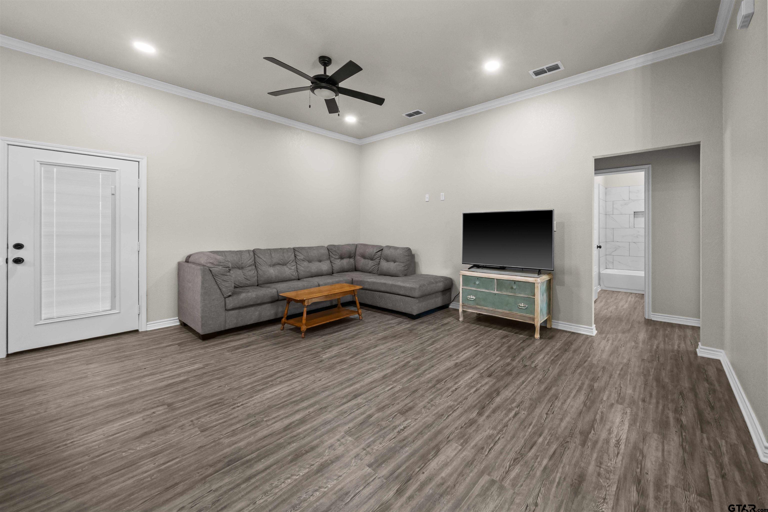 17023 County Road 2282 Troup, TX 75789 - Photo 4 of 30 a living room with furniture and a wooden floor