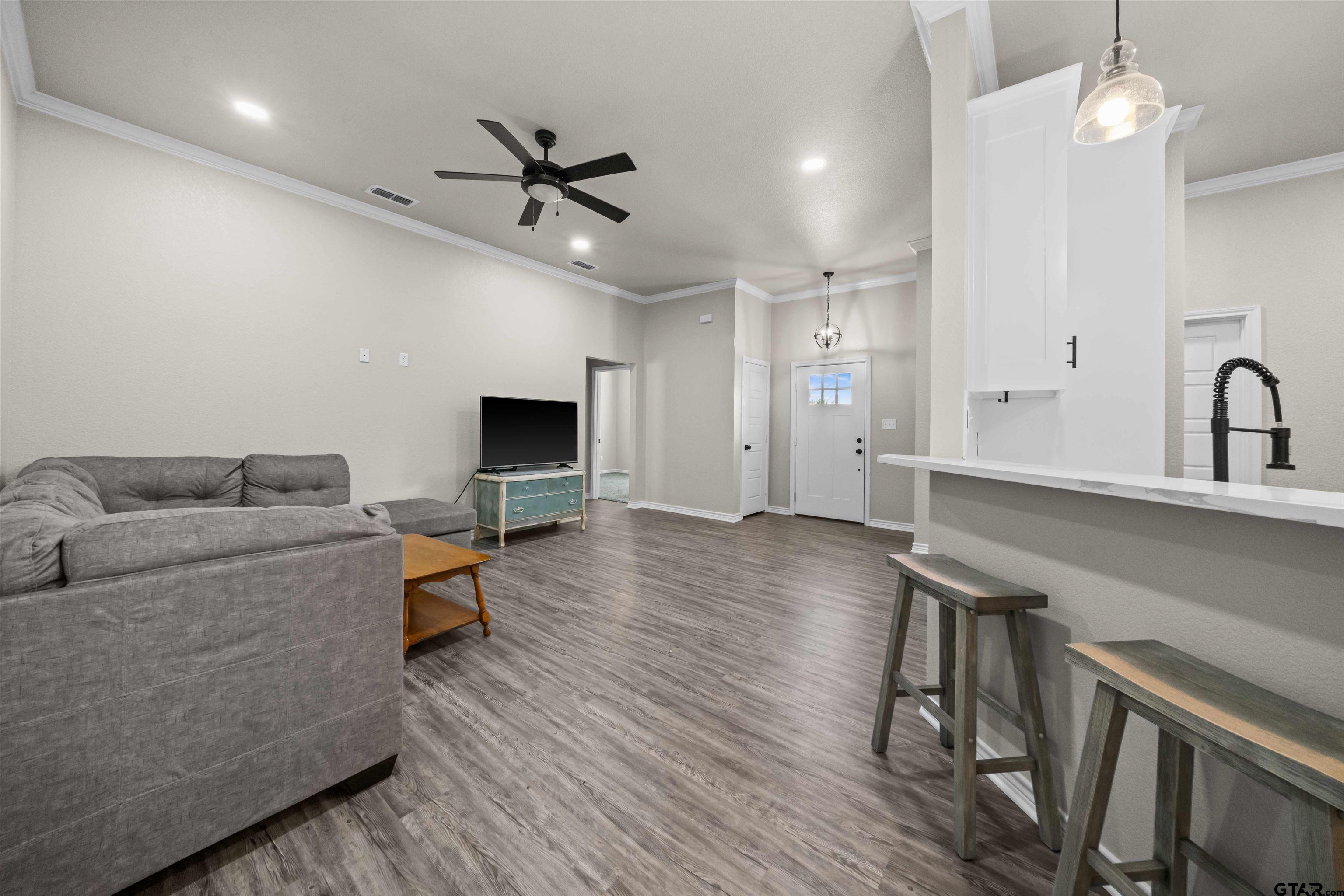 17023 County Road 2282 Troup, TX 75789 - Photo 6 of 30 a living room with furniture and a fireplace