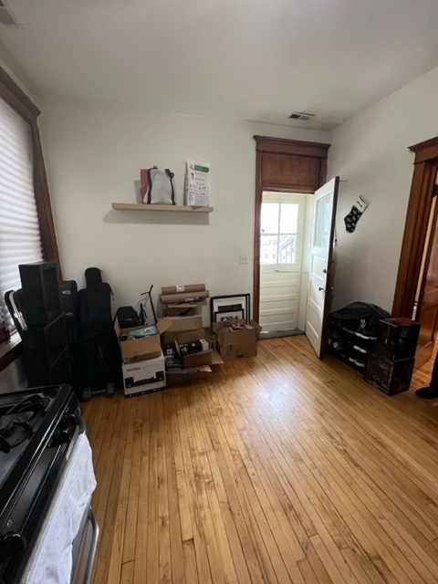 2130 West Iowa Street, Unit 1R Chicago, IL 60622 - Photo 13 of 16 a living room with furniture and a wooden floor