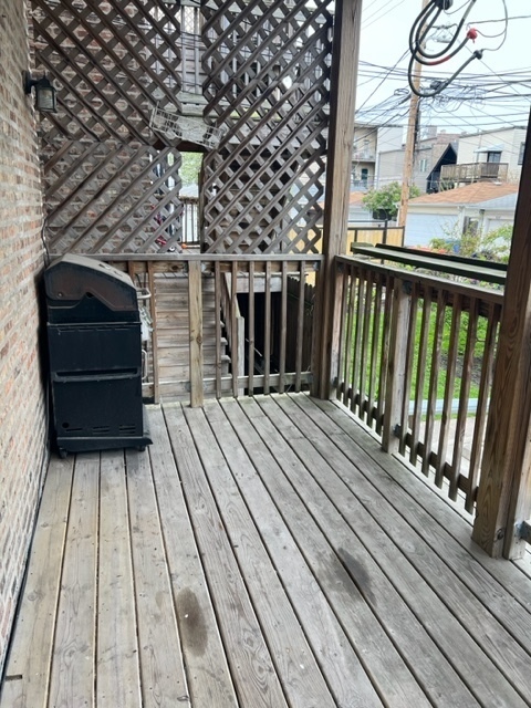 2130 West Iowa Street, Unit 1R Chicago, IL 60622 - Photo 14 of 16 a view of a balcony with wooden floor