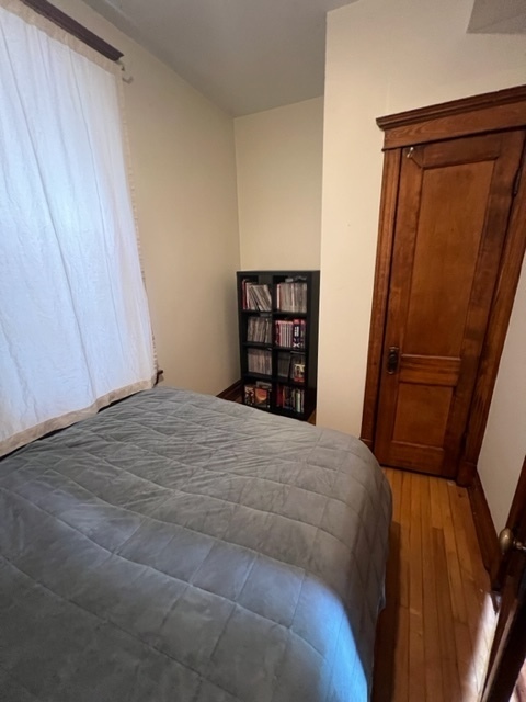 2130 West Iowa Street, Unit 1R Chicago, IL 60622 - Photo 3 of 16 a bedroom with a bed and a window