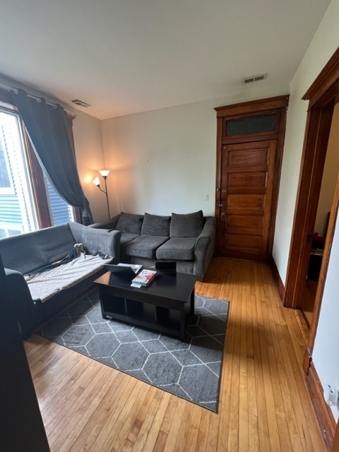 2130 West Iowa Street, Unit 1R Chicago, IL 60622 - Photo 7 of 16 a living room with furniture and a fireplace