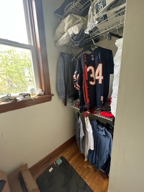 2130 West Iowa Street, Unit 1R Chicago, IL 60622 - Photo 9 of 16 a view of walk in closet with clothes and shoes
