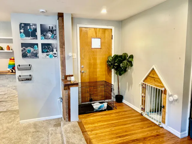 a view of living room with furniture and wooden floor