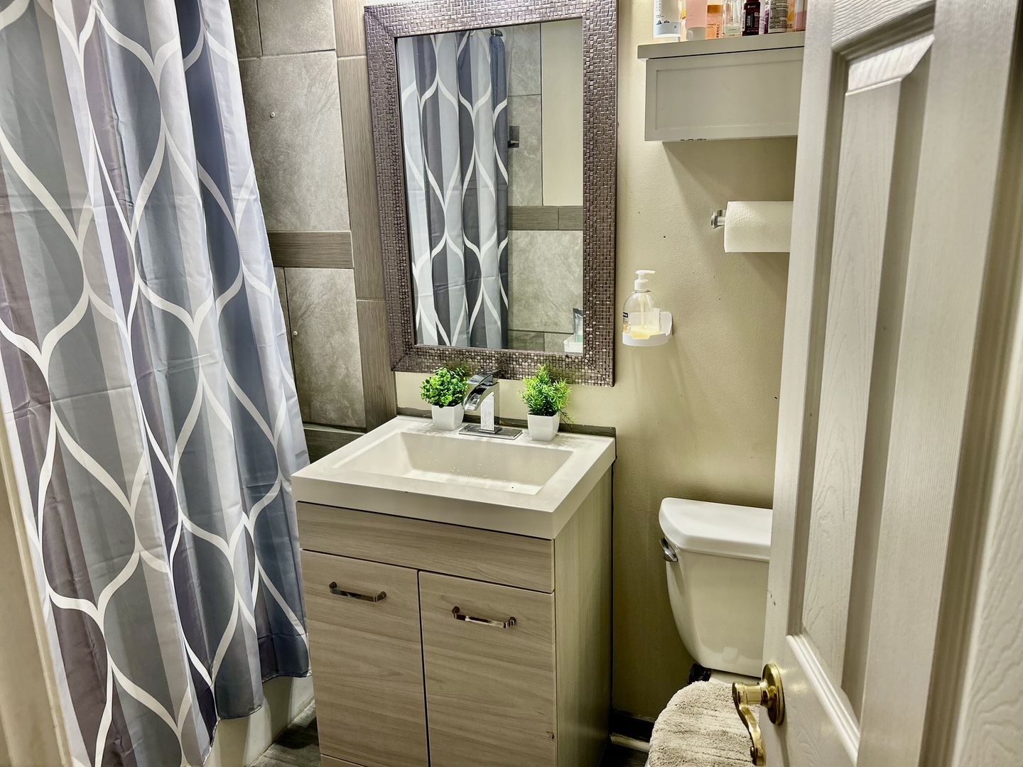 17308 Forestway Drive East Hazel Crest, IL 60429 - Photo 18 of 27 a bathroom with a sink a toilet and shower curtain