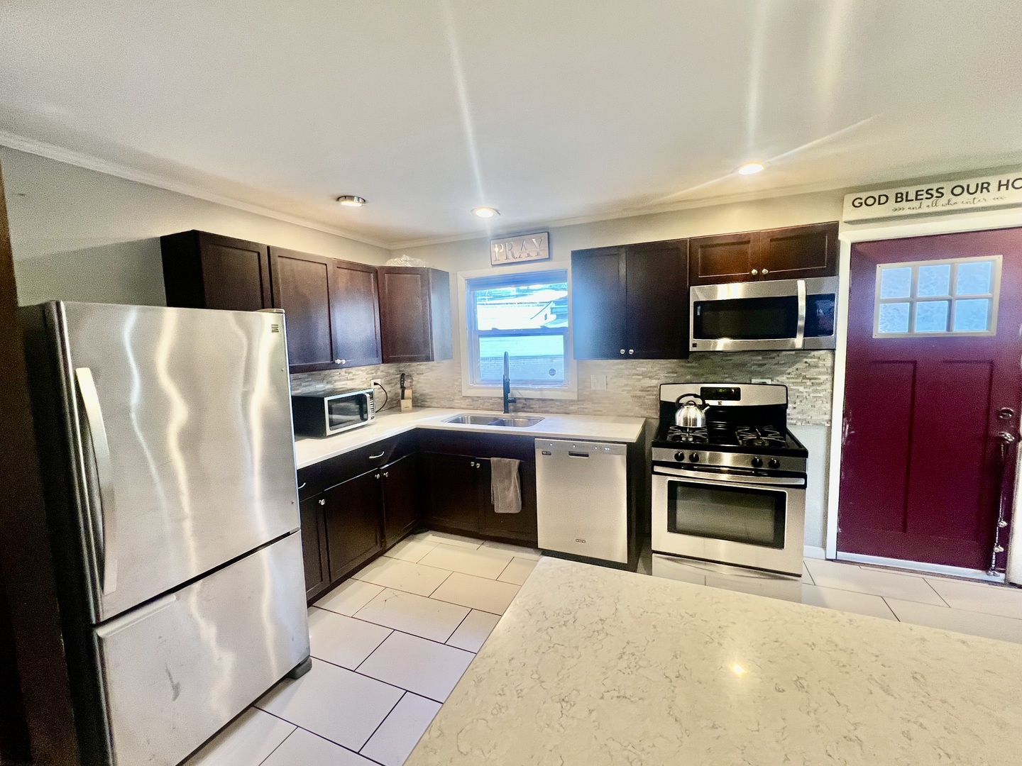 17308 Forestway Drive East Hazel Crest, IL 60429 - Photo 5 of 27 a kitchen with stainless steel appliances granite countertop a refrigerator stove microwave and sink