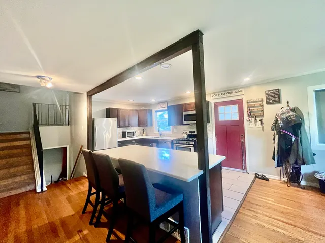 a dining room with furniture and window