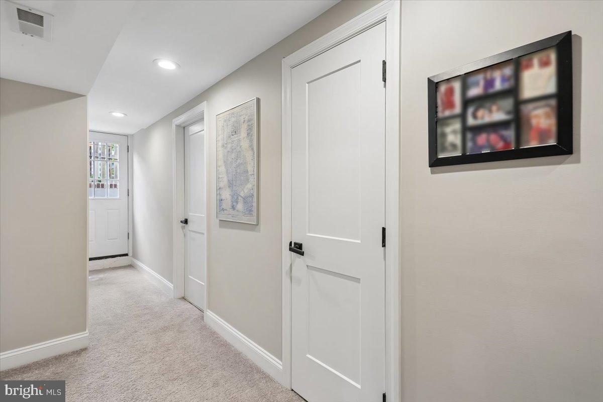 8812 2nd Avenue Silver Spring, MD 20910 - Photo 36 of 64 Carpeted hallway to laundry room & walk-up exit
