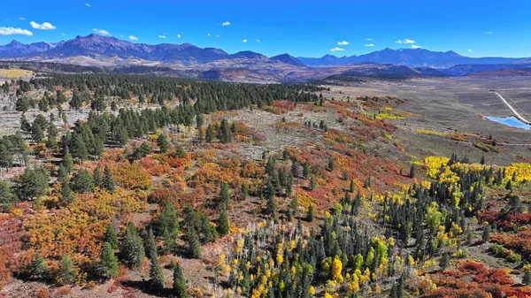 a view of a city with mountains in the background