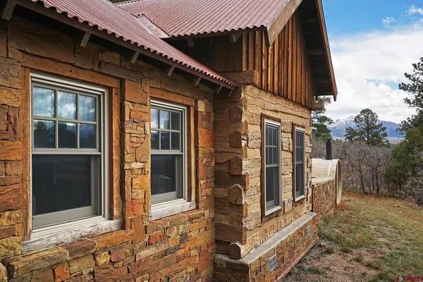 a living room with furniture fireplace and flat screen tv