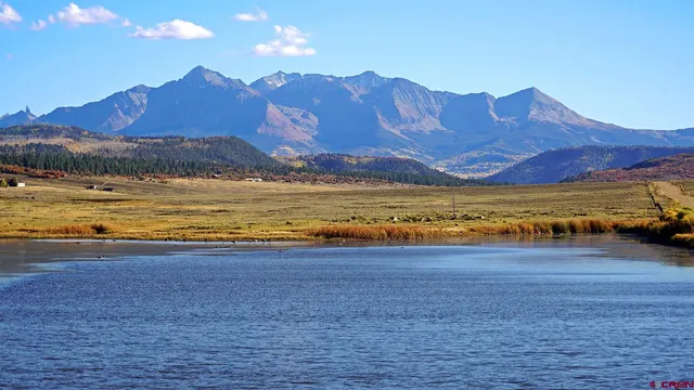 a view of an ocean and a mountain