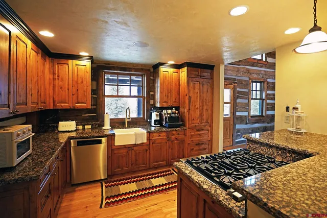 a view of a dining room with furniture and window