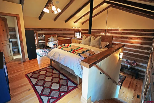 a bed room with a bed and a window