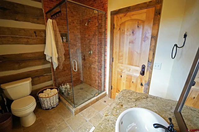 a view of a balcony with wooden floor
