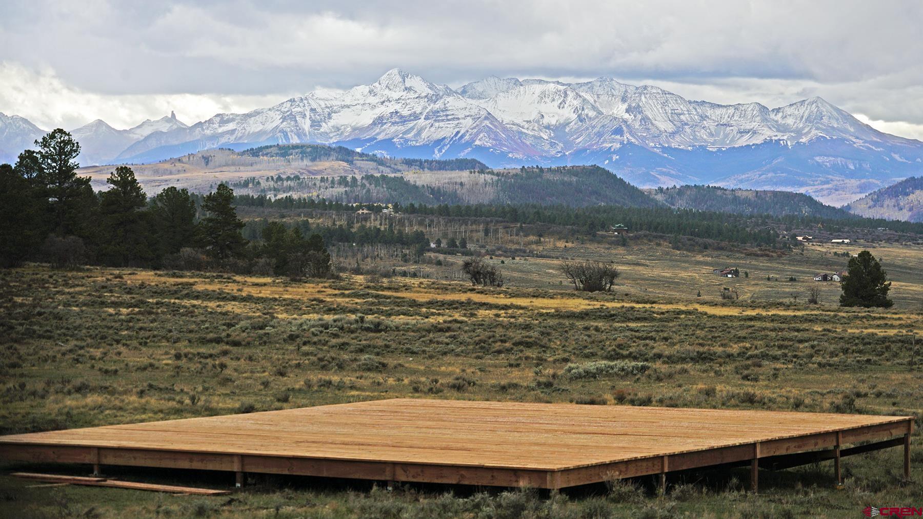1250 McKenzie Springs Road Placerville, CO 81430 - Photo 43 of 45 a view of a lake with a mountain