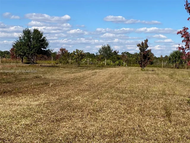 a view of a lake with a big yard