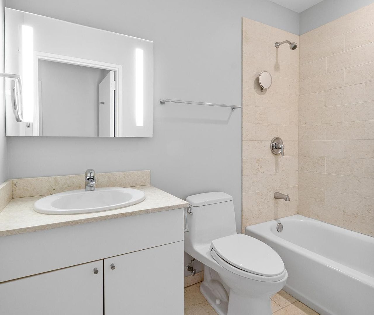 653 North Kingsbury Street, Unit 2004 Chicago, IL 60654 - Photo 11 of 15 a bathroom with a sink a toilet and shower