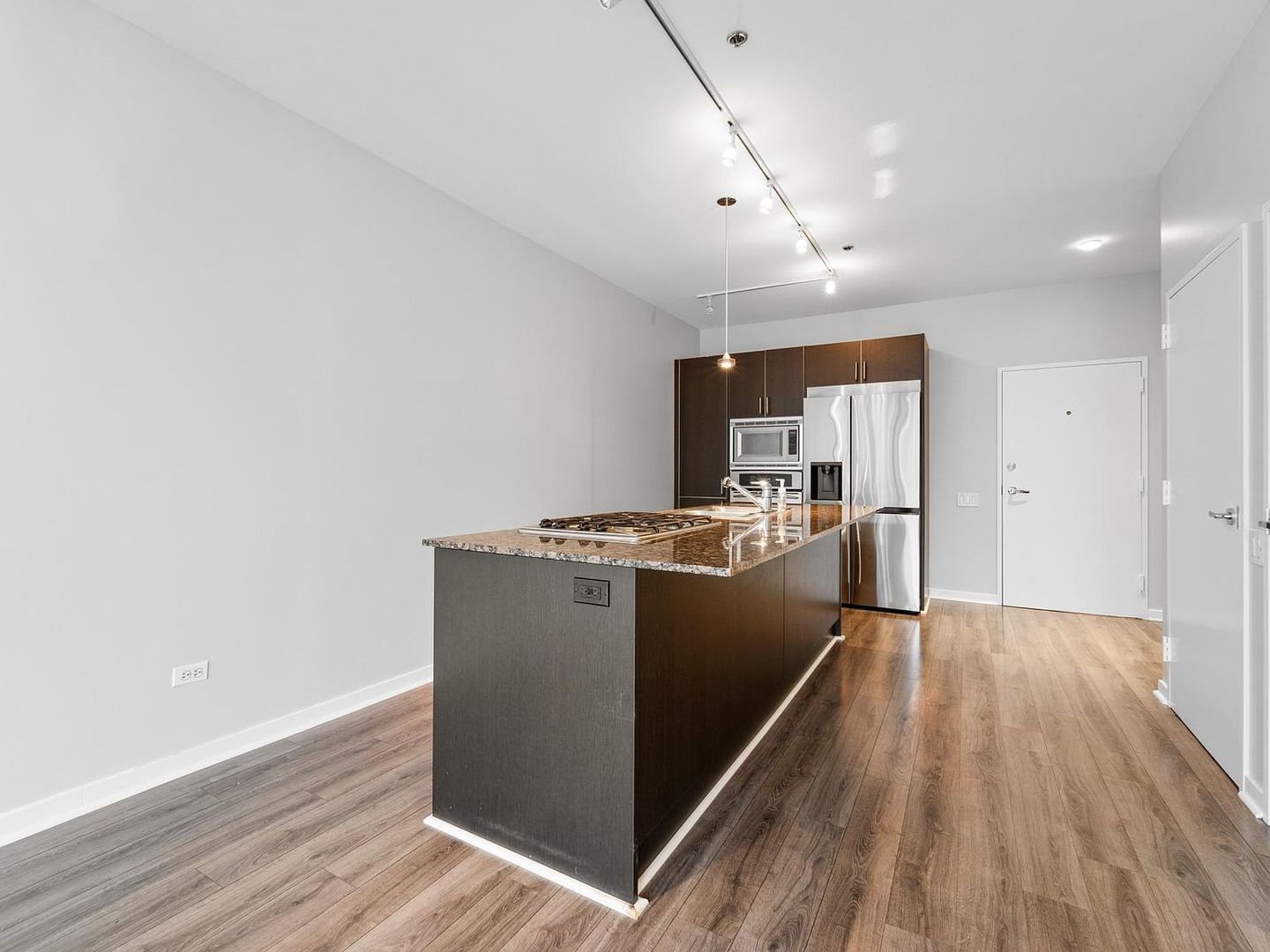653 North Kingsbury Street, Unit 2004 Chicago, IL 60654 - Photo 7 of 15 a view of a kitchen with wooden floor