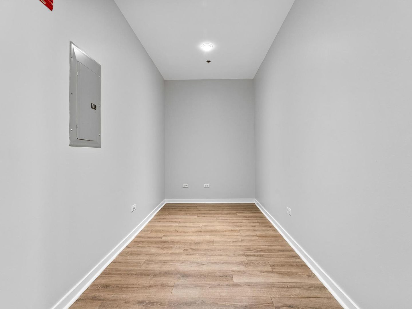 653 North Kingsbury Street, Unit 2004 Chicago, IL 60654 - Photo 8 of 15 a view of a hallway with wooden floor