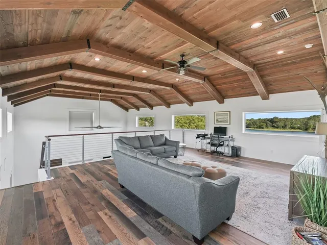 a view of a living room and floor to ceiling window