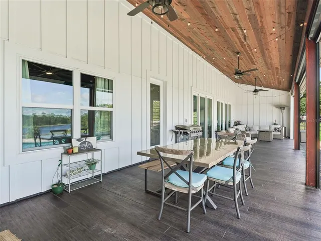 a view of a house with a big yard and a fountain
