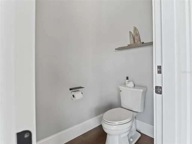 a view of a lake with houses in the back