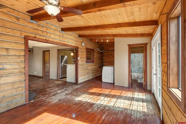 a view of a kitchen with a sink and large window
