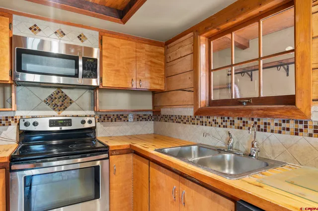 a kitchen with a stove and a microwave