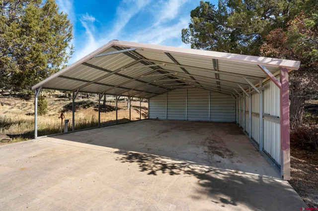 a view of a house with a snow in the yard