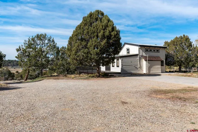 a view of a terrace with a garden and mountain view
