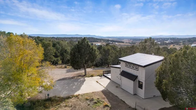 an aerial view of residential house with outdoor space